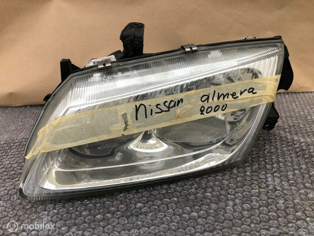 Koplamp links nissan almera Origineel, Gebruikt, Ophalen of Verzenden