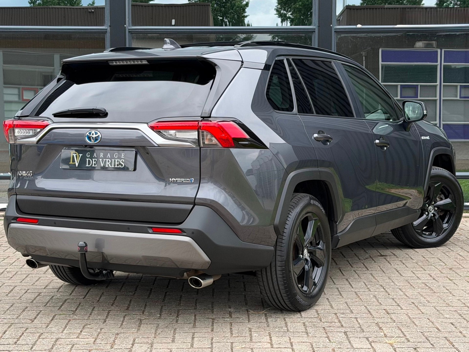 Toyota RAV4 2.5 Hybrid Executive ACC Panoramadak Trekhaak Ga, Auto's, Stof, Gebruikt, Zwart, 4 cilinders