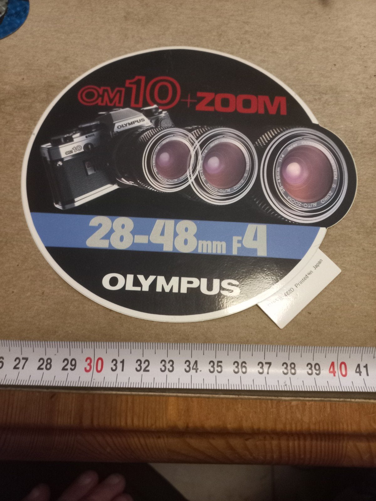 Olympus OM10 + Zoom 28-48mm f/4 sticker, Ophalen of Verzenden