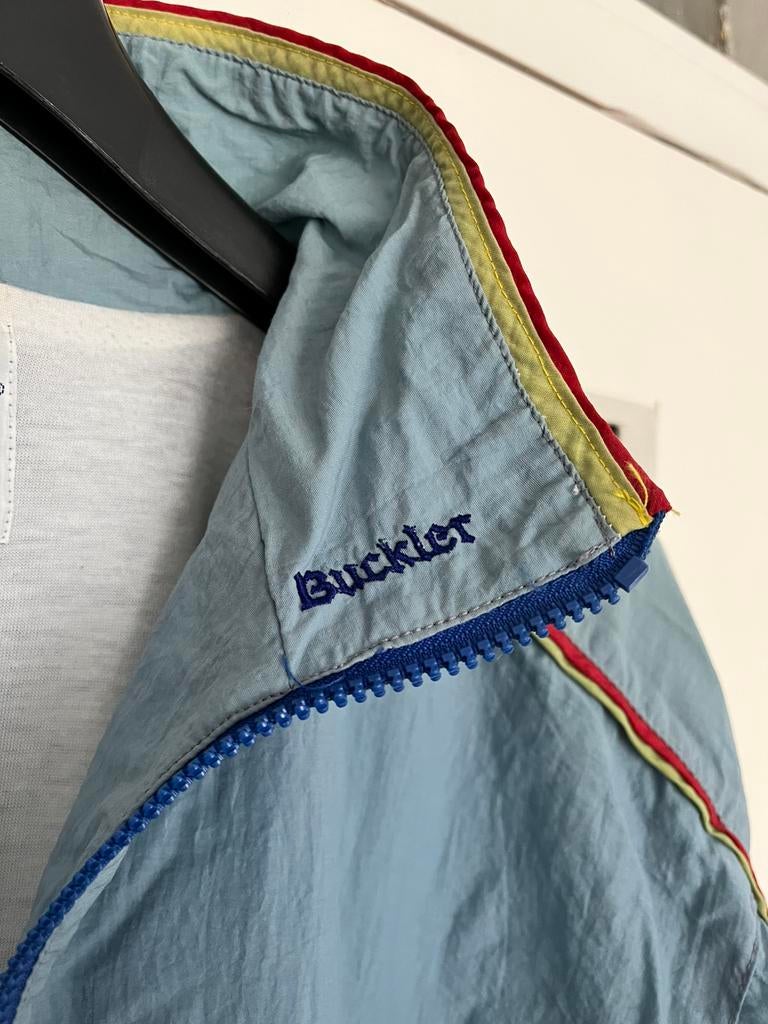 Buckler trainingsjas - wielerploeg circa 1990- zeldzaam, Ophalen of Verzenden, Gebruikt, Kleding, Overige merken