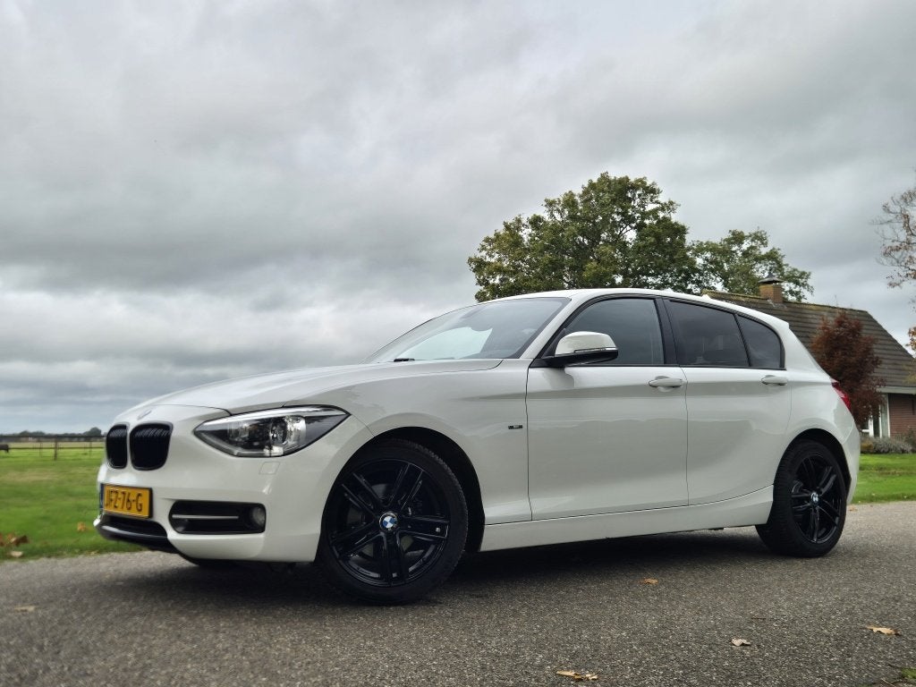 Bmw 1-serie 114i EDE Upgrade Ed., Auto's, Achterwielaandrijving, Gebruikt, Euro 6, 4 cilinders