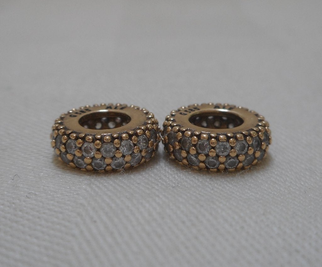Pandora 14 kt gouden set 2 spacers met zirkonia nr.1776, Verzenden, Pandora, Zo goed als nieuw, 2 of 3 bedels
