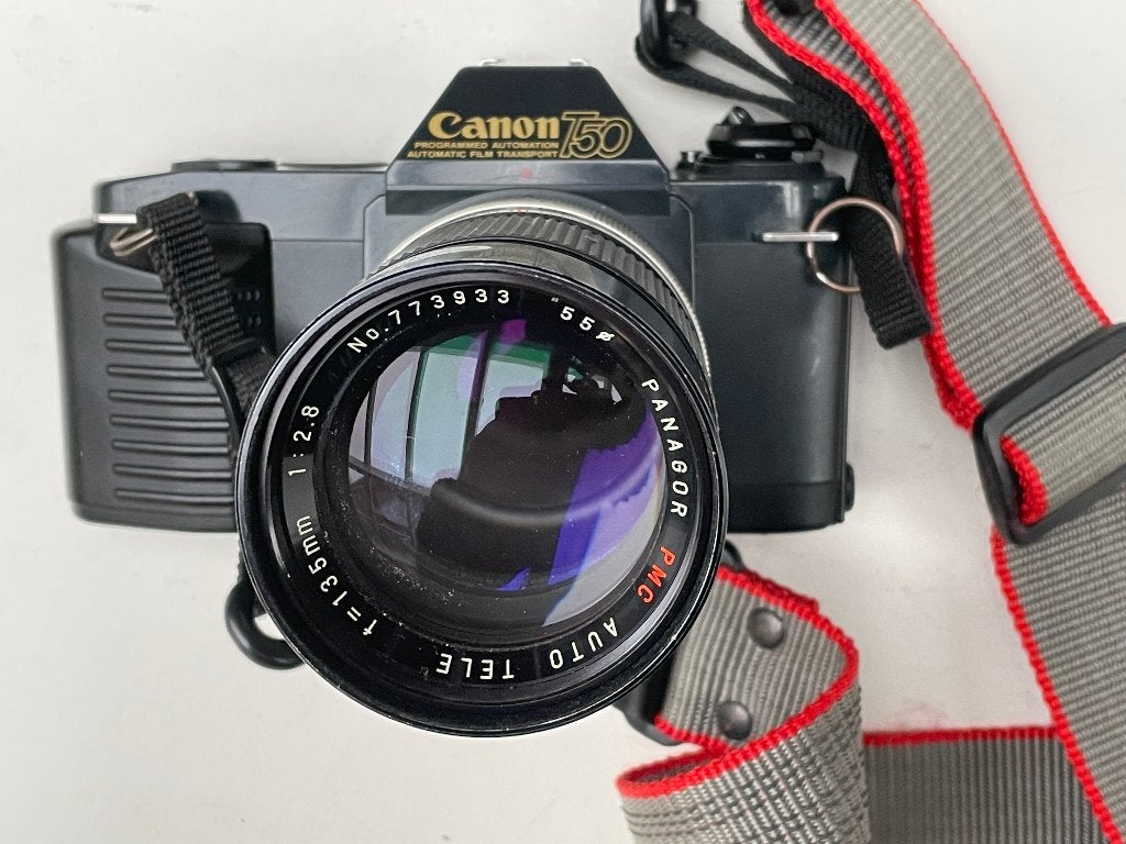 Canon T50 met Panagor 135mm (80 er jaren) "Winder" camera, Audio, Tv en Foto, Fotocamera's Analoog, Ophalen of Verzenden, Spiegelreflex