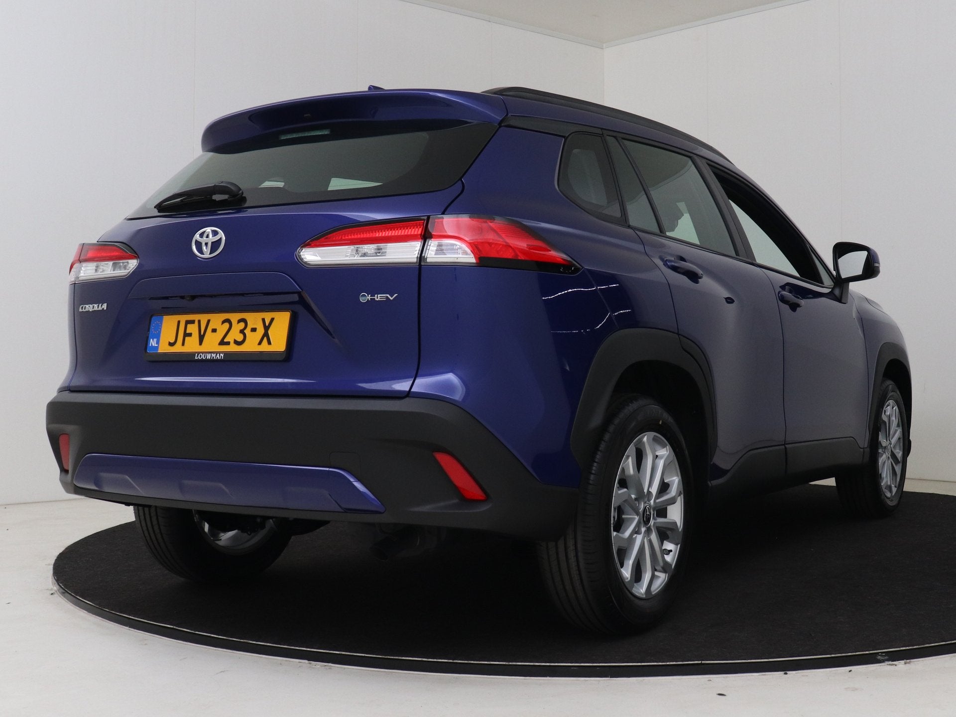 Toyota Corolla Cross Hybrid 140 Active (bj 2025, automaat), Auto's, 12 maanden, Stof, Blauw, Stoelverwarming