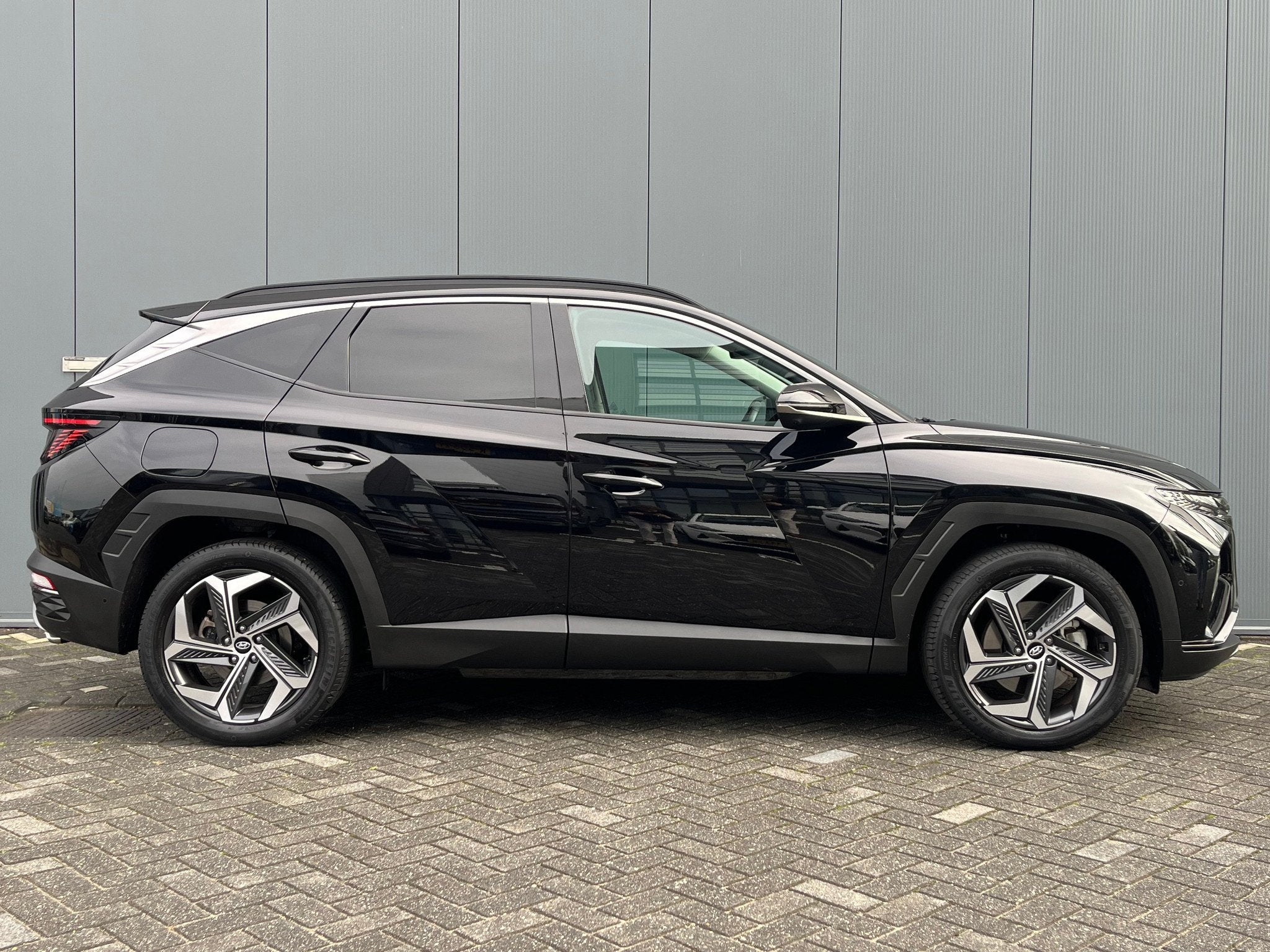 Hyundai Tucson 1.6 T-GDI 265pk PHEV Premium 4WD, Auto's, Hyundai, Gebruikt, 4 cilinders, Zwart, Bedrijf