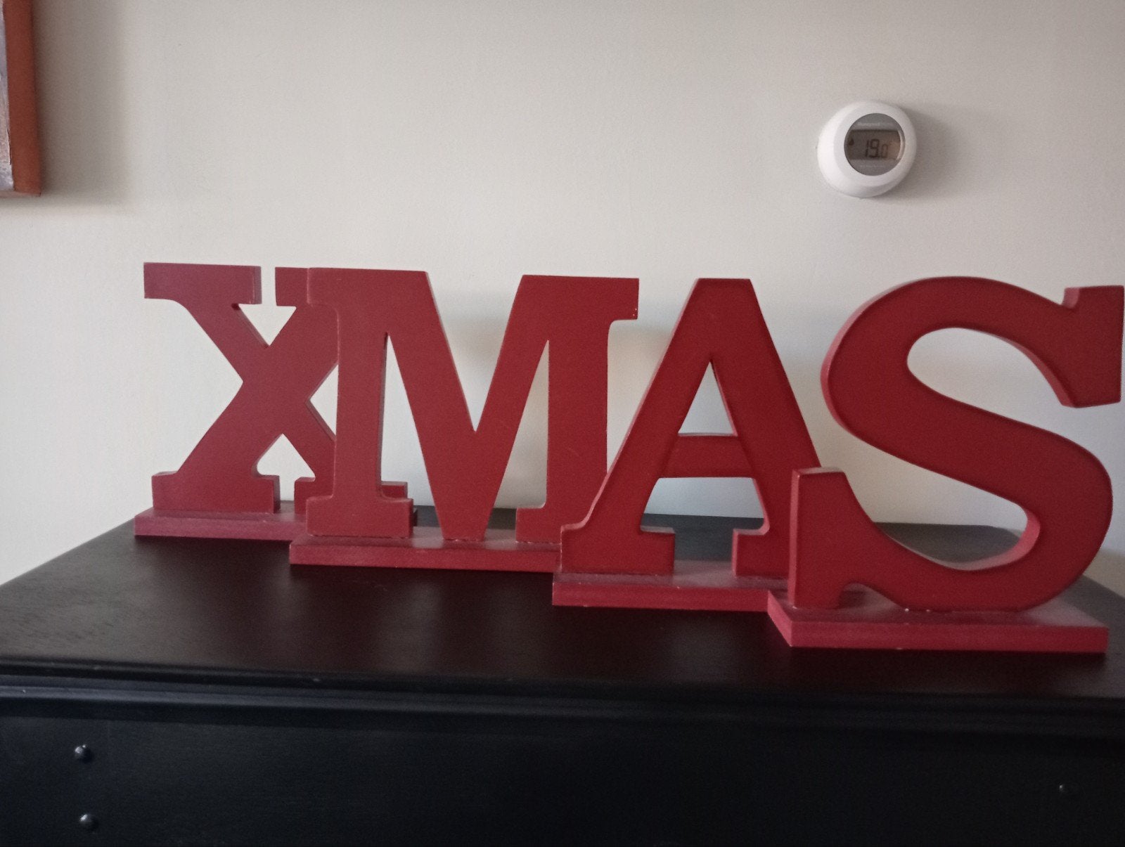 vier houten letters xmas, Ophalen