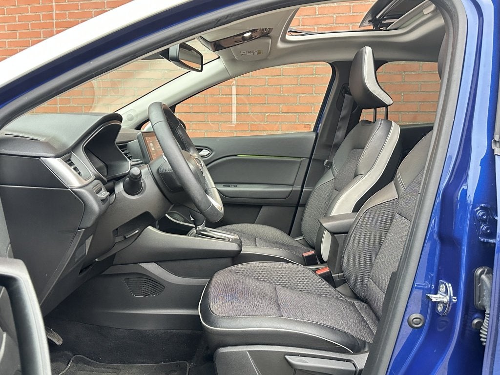 Renault Captur 1.6 E-Tech Hybride 145 Intens Panorama Schuif, Auto's, Gebruikt, Blauw, Leder en Stof, Bedrijf