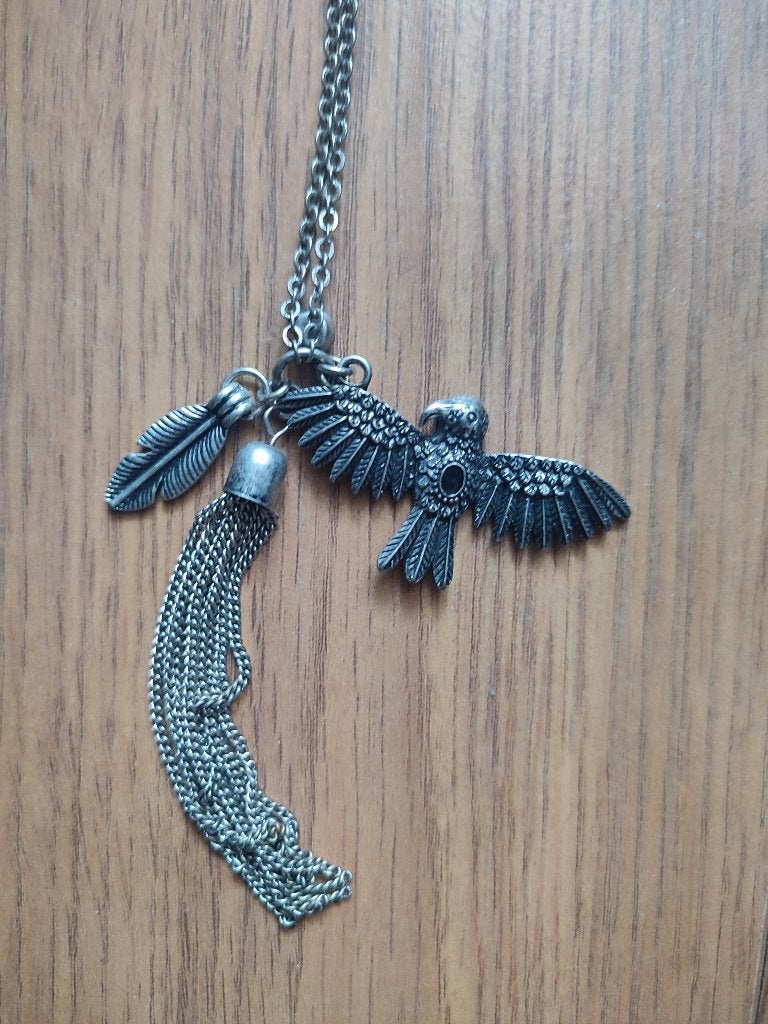 Mooie ketting met o.a. vogel en een veer te koop!, Nieuw, Ophalen of Verzenden, Zilver, Overige materialen