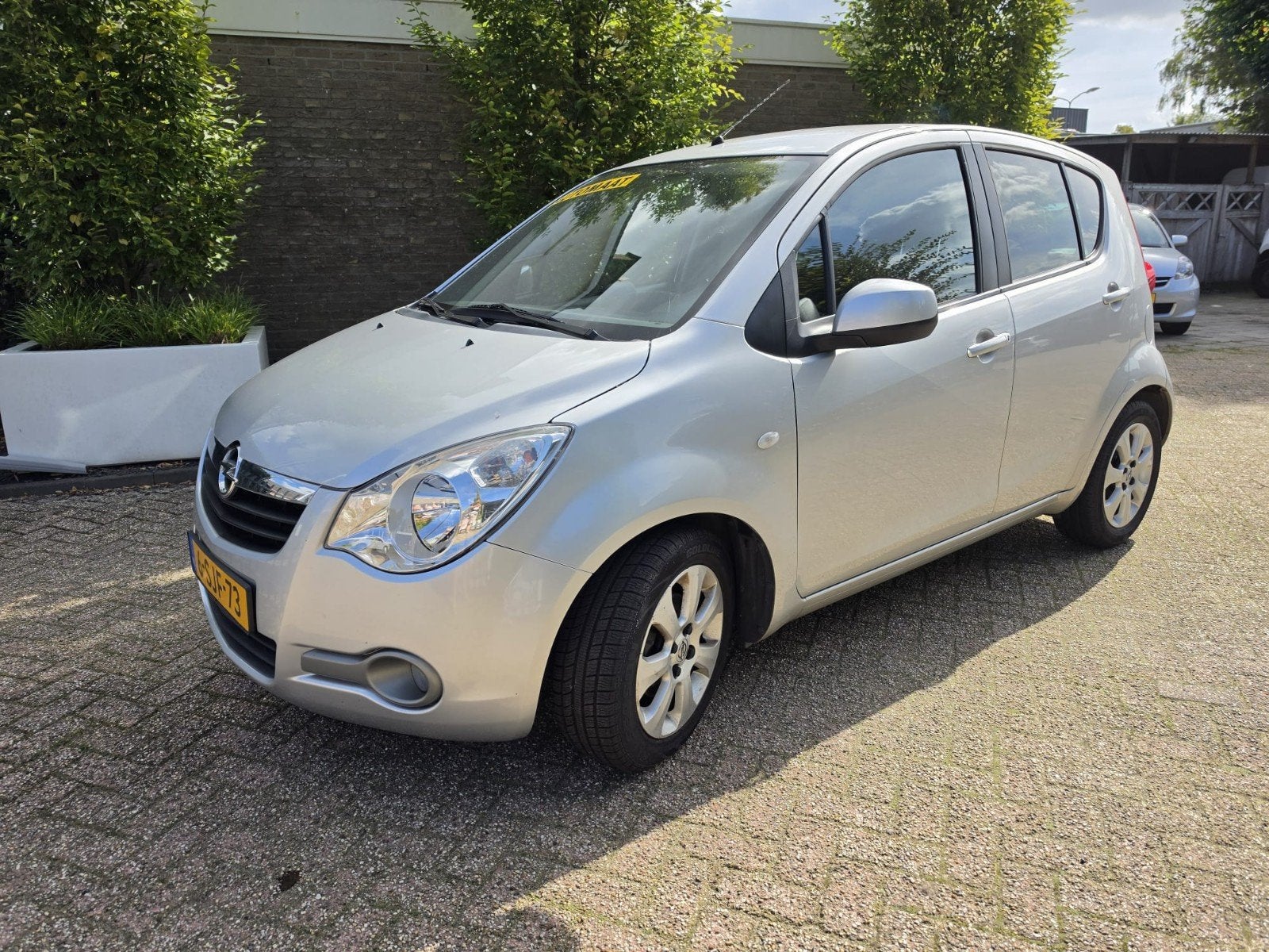 Opel Agila 1.2 16V AUT 2008 Grijs 62532 km incl boekjesAirco, Auto's, Stof, 40 €/maand, 4 cilinders, Bedrijf