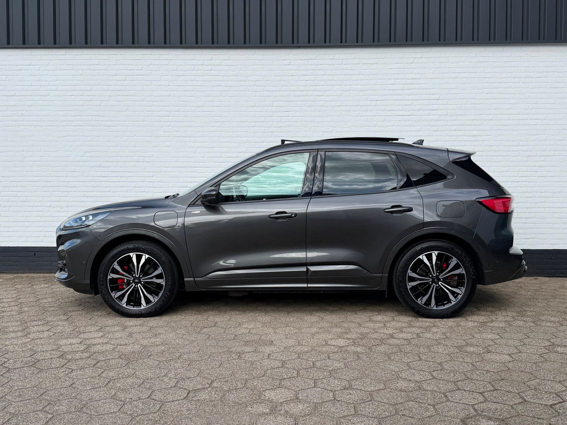 Ford Kuga 2.5 PHEV ST-Line X PANO l ACC l CAMERA l B&O l TOP, Auto's, Gebruikt, Zwart, 4 cilinders, Hybride Elektrisch/Benzine