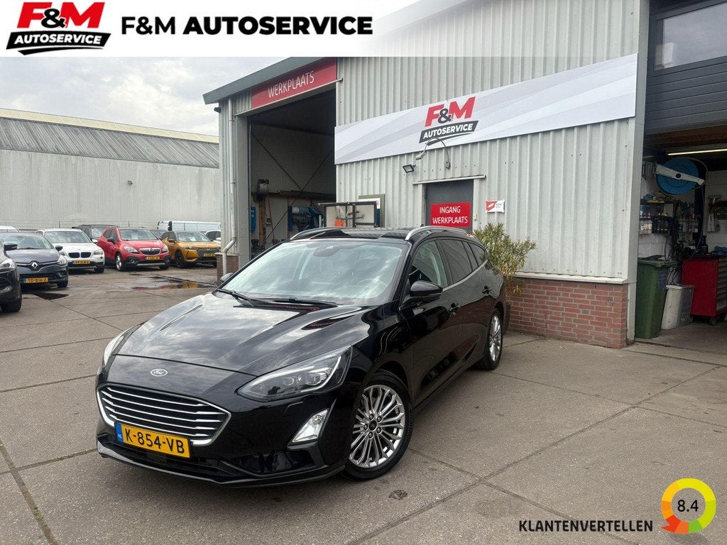 Ford Focus Wagon 1.0 EcoBoost Titanium Business Stoel-Stuurv, Auto's, Ford, Gebruikt, Euro 6, 715 kg, Zwart