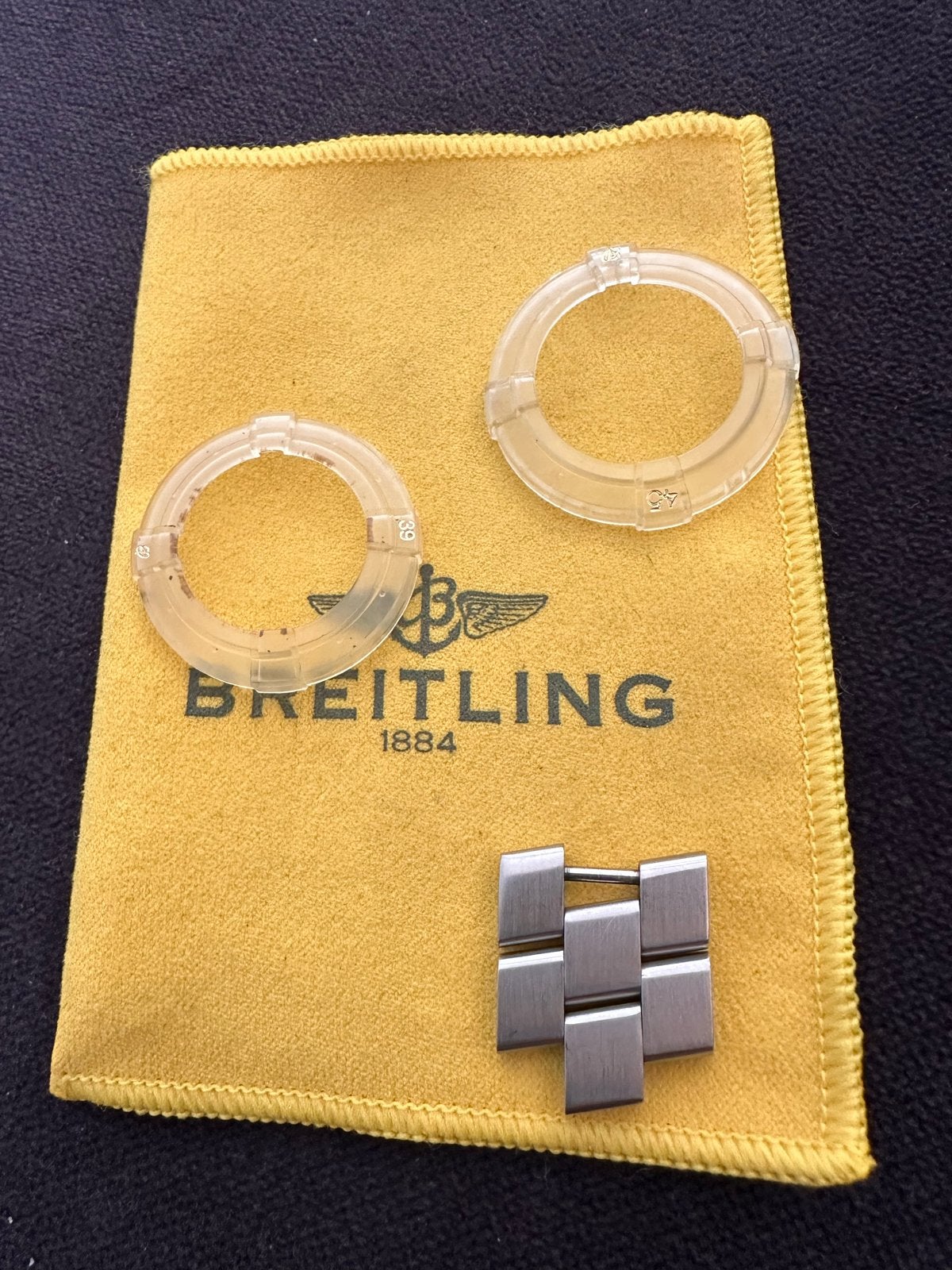 Breitling stofzakje, schakels en bezelbeschermers, Ophalen of Verzenden, Zo goed als nieuw