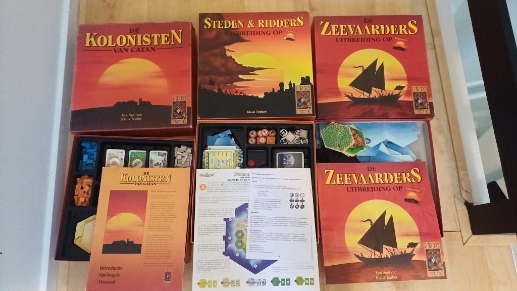bordspellen pakket Catan houten speelstukken + zee + Ridders, Een of twee spelers, Ophalen of Verzenden, Zo goed als nieuw, 999 Games