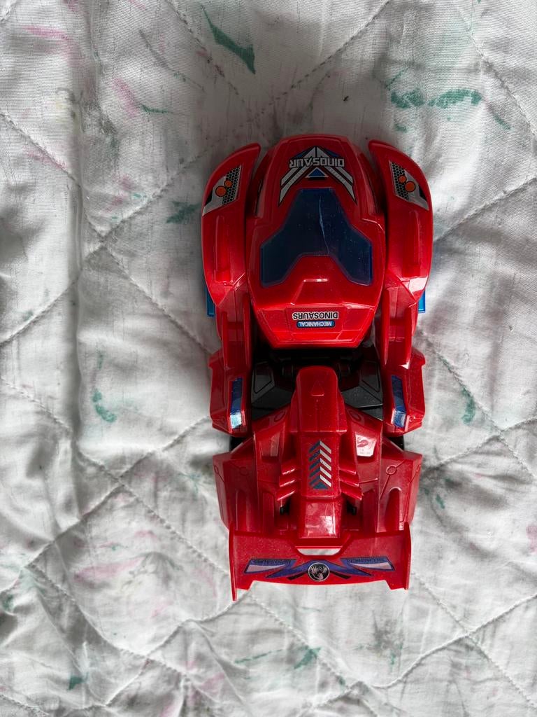 Dinosaurusspeelgoedauto Rood - Transformers, Overige generaties, Ophalen of Verzenden, Zo goed als nieuw