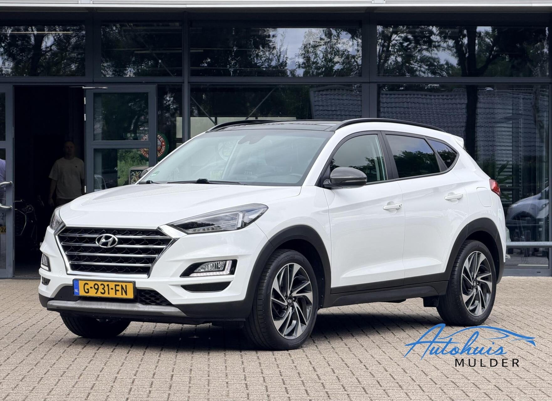Hyundai Tucson 1.6 T-GDi Premium 4WD | Pano | Stoel-Stuurver, Auto's, Gebruikt, 4 cilinders, Lichtsensor, Wit