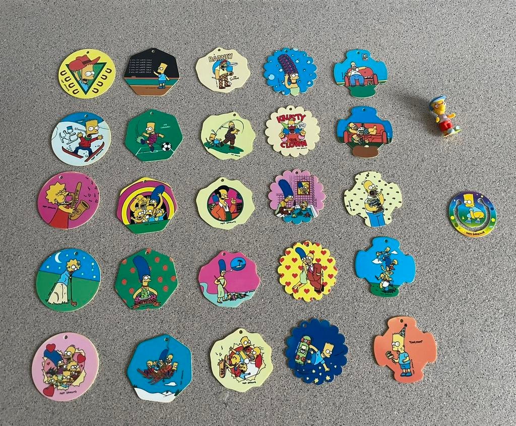 25 The Simpsons flippo’s Milhouse poppetje en n paperclip, Ophalen of Verzenden, Losse flippo's