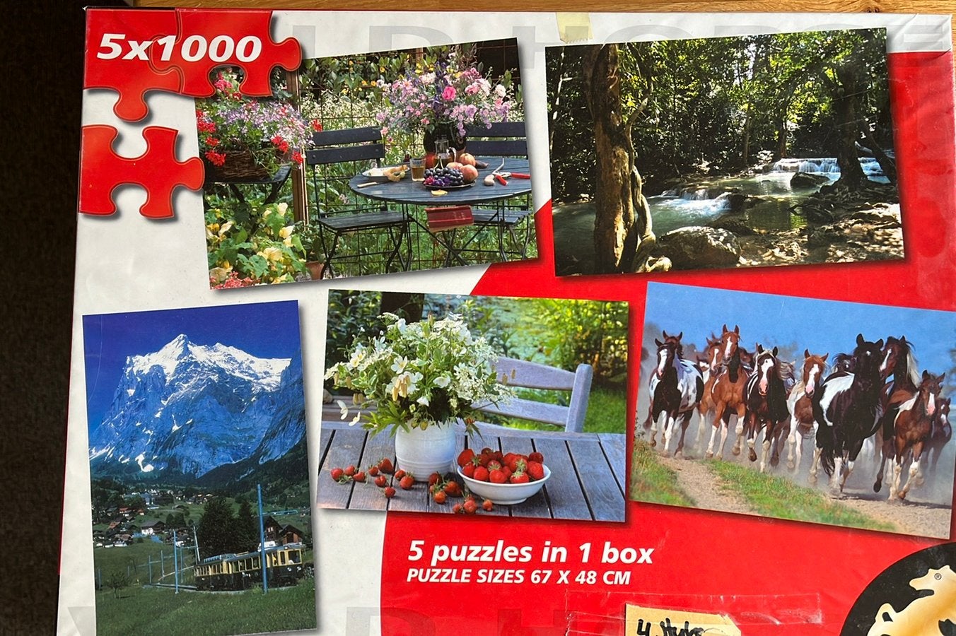 4 puzzels van 1000 stukjes in één doos., Ophalen of Verzenden, 500 t/m 1500 stukjes, Gebruikt, Legpuzzel