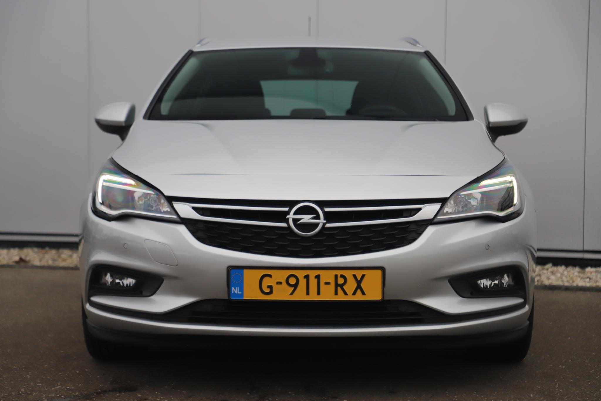 Opel Astra Sports Tourer 1.0 Turbo 120 Jaar Edition 16 inch, Stof, Gebruikt, Euro 6, 1178 kg