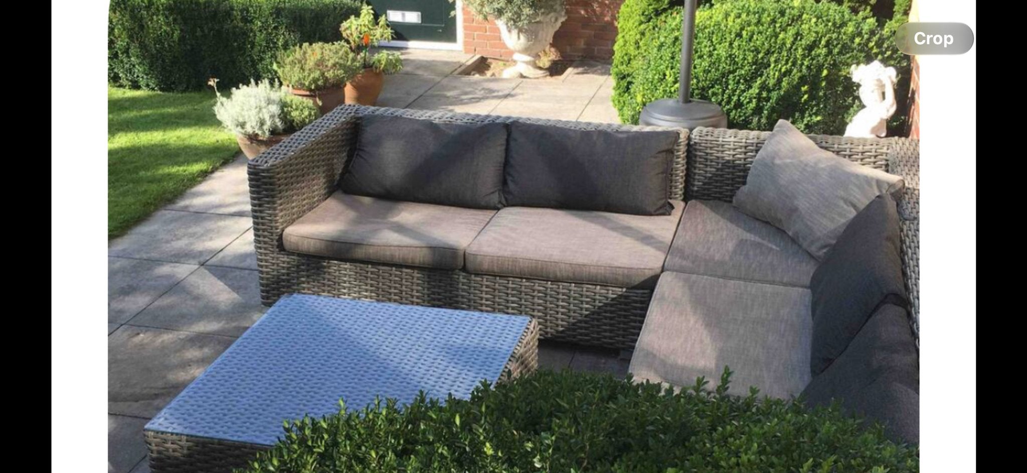 Antraciet gevlochten tuinset met hocker/tafel en kussens, Ophalen, Kunststof, Gebruikt, Tuinset