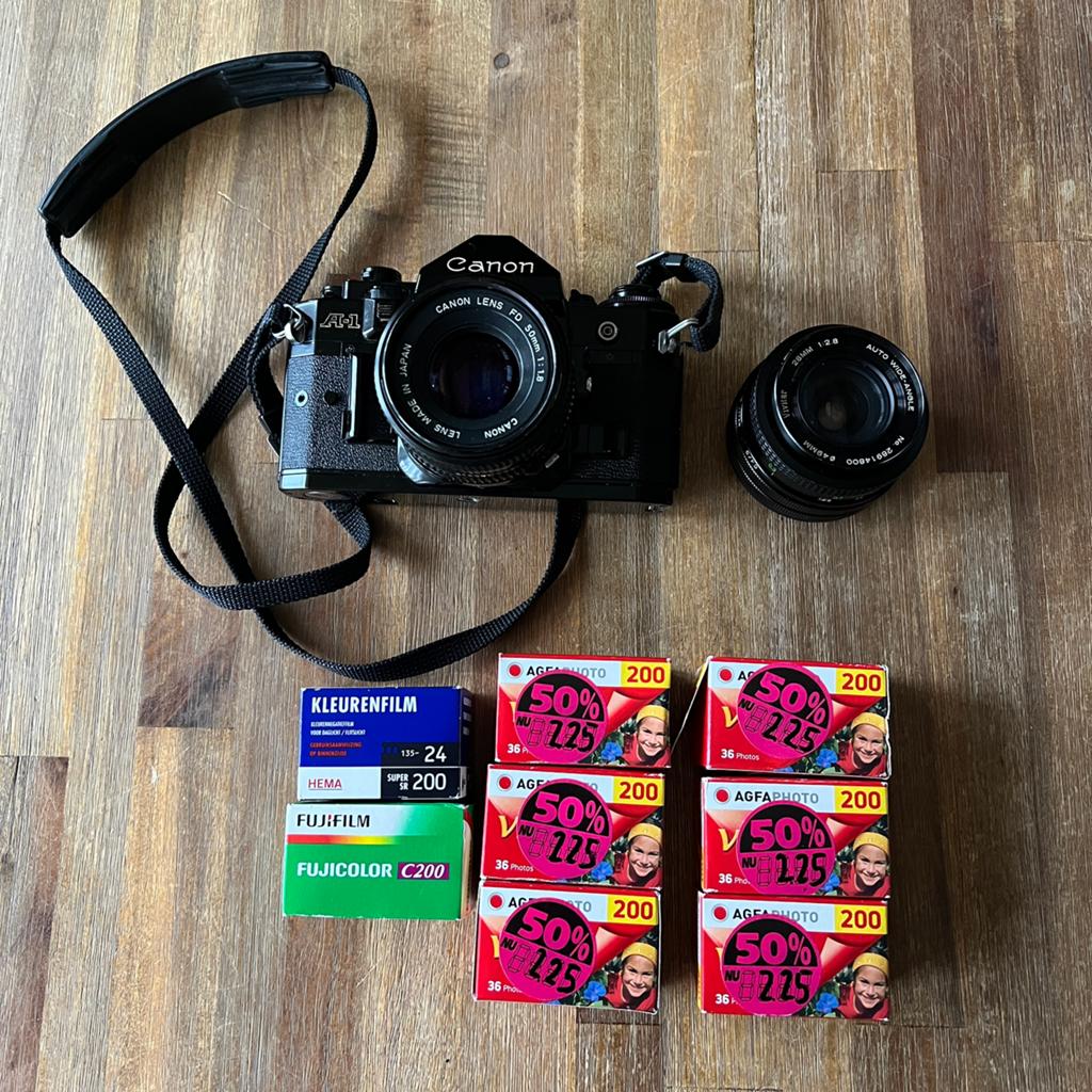 Canon A-1 analoog + 2 lenzen + 8 fotorolletjes, Audio, Tv en Foto, Fotocamera's Analoog, Ophalen of Verzenden, Gebruikt, Spiegelreflex