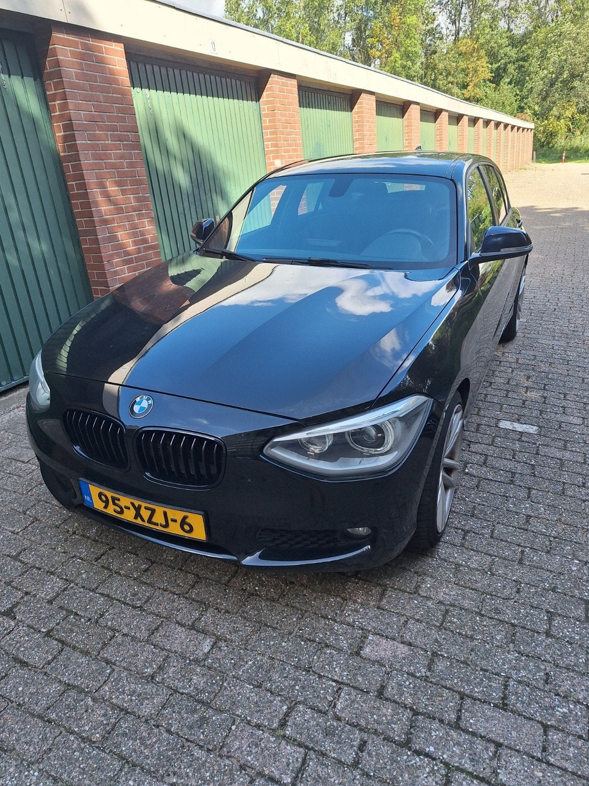 BMW 1-Serie 116I 100KW 5DR Aut8 2012 Zwart, Auto's, BMW, 4 cilinders, Zwart, Origineel Nederlands, 1200 kg