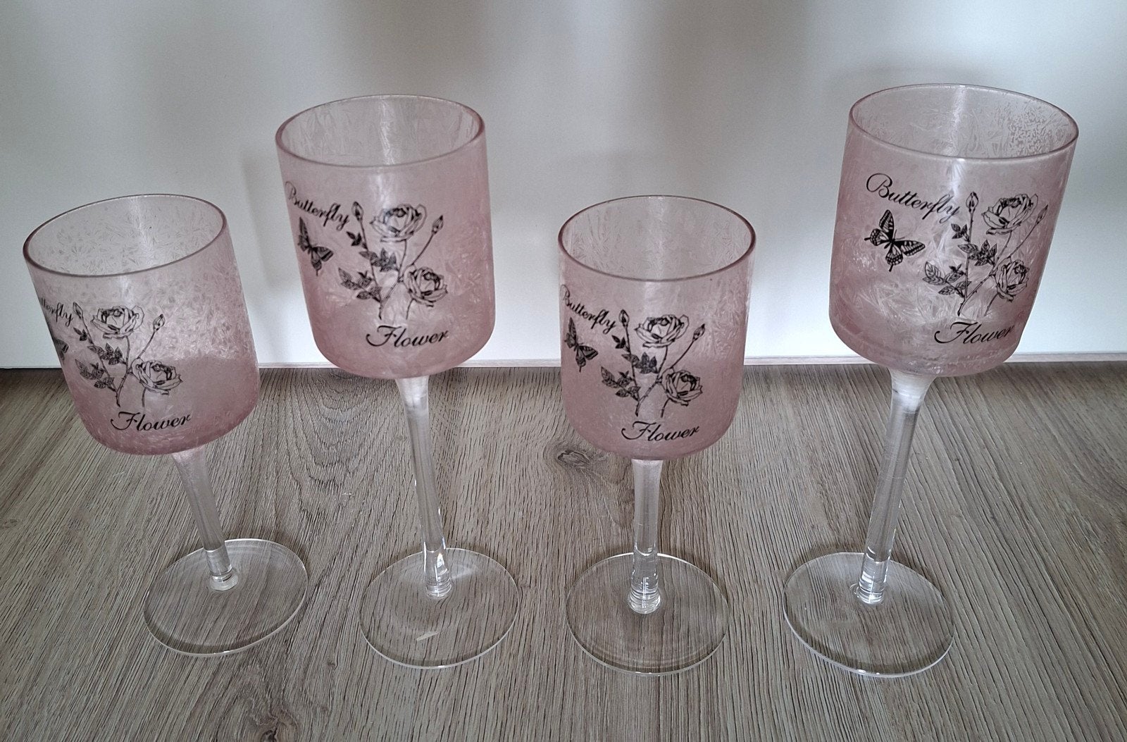 Set van 4 roze waxinelichthouders op voet, Ophalen of Verzenden, Zo goed als nieuw, Roze, Glas