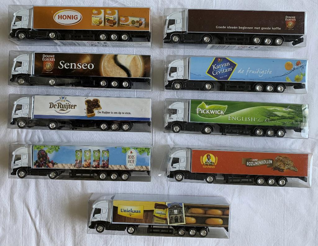 9 vrachtauto's met reclame in doosje 19 cm, Ophalen, Zo goed als nieuw, Overige typen