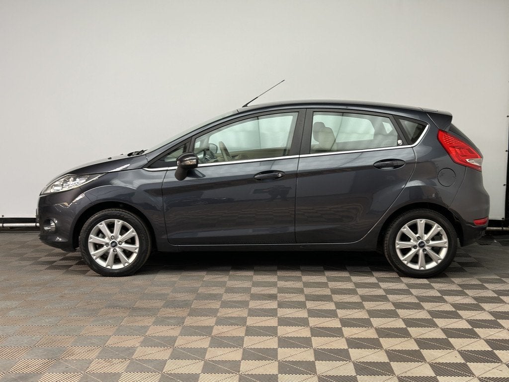 Ford Fiesta 1.25 Ghia 5-drs ECC LM15" NL Auto (bj 2011), Voorwielaandrijving, Euro 5, Stof, Met garantie (alle)