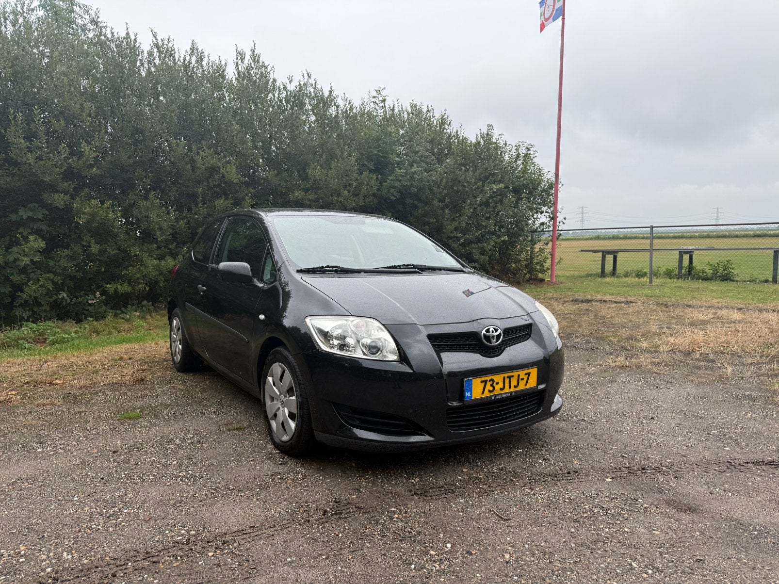 Toyota Auris 1.3 Vvt-i 3DR 2009 Zwart met nieuw Apk, Auto's, Voorwielaandrijving, Euro 5, Zwart, 4 cilinders