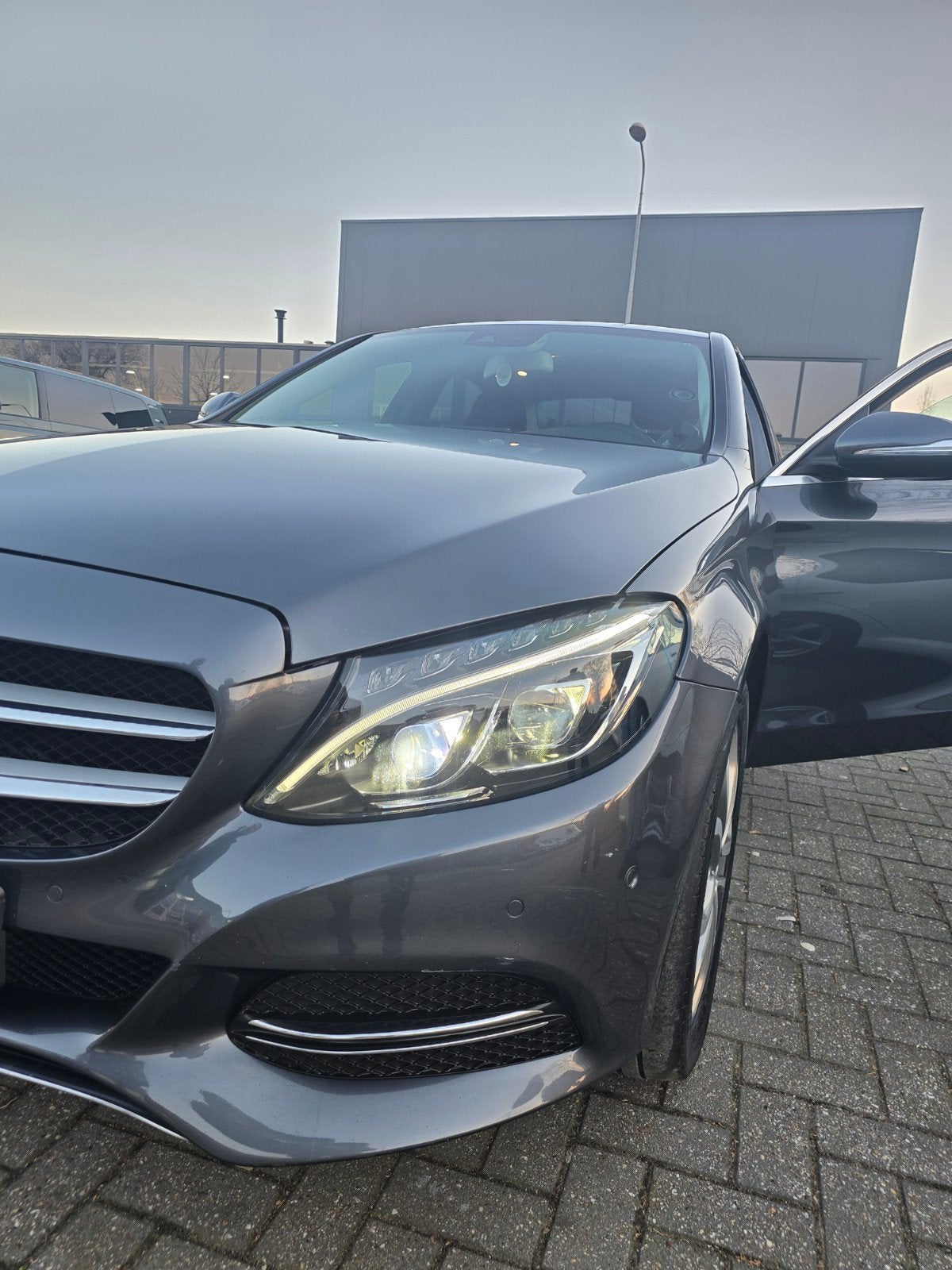 Mercedes-Benz C-Klasse C180 1.6 115KW 2015 Grijs km 206000, Achterwielaandrijving, 1295 kg, Handgeschakeld, Particulier