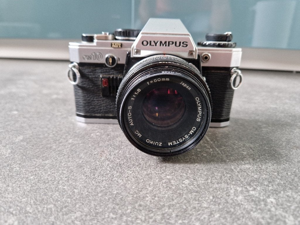 Olympus OM10 met 50mm f/1.8 lens en accessoires, Ophalen of Verzenden, Gebruikt, Spiegelreflex, Olympus