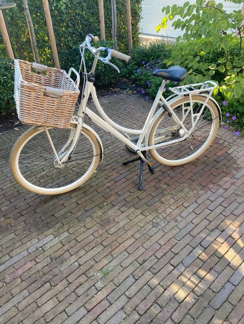 Te koop: Batavus damesfiets met mand, Ophalen, Gebruikt, 56 cm of meer, Handrem