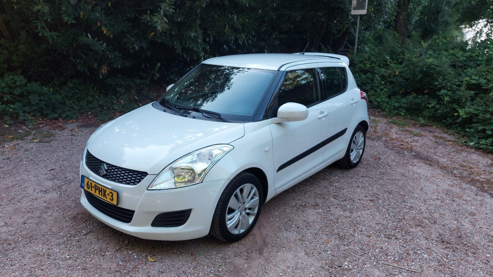 Suzuki Swift 1.2  2011 5 DEURS/ PARELMOER WIT/ SPOILER/ LM, Voorwielaandrijving, Stof, 4 cilinders, 400 kg