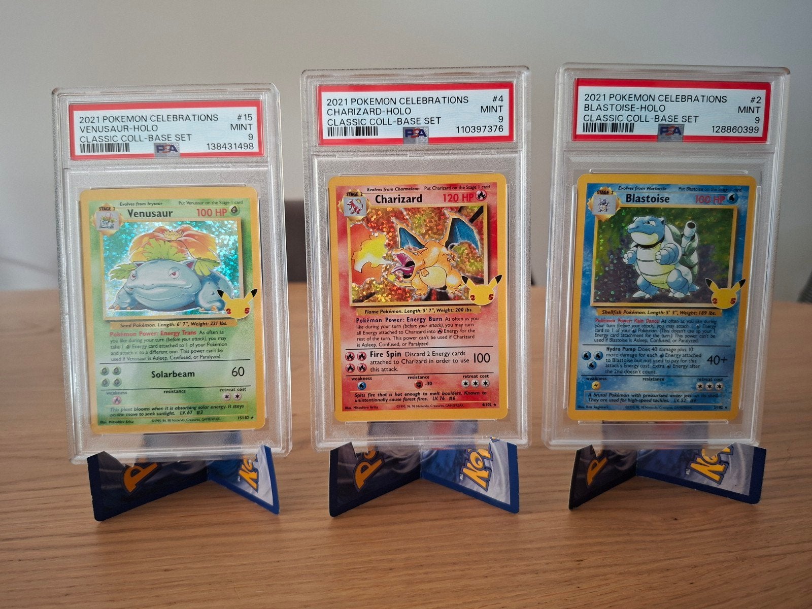 Pokémon Celebrations PSA 9 Charizard, Blastoise, Venusaur, Ophalen of Verzenden, Zo goed als nieuw, Meerdere kaarten, Foil