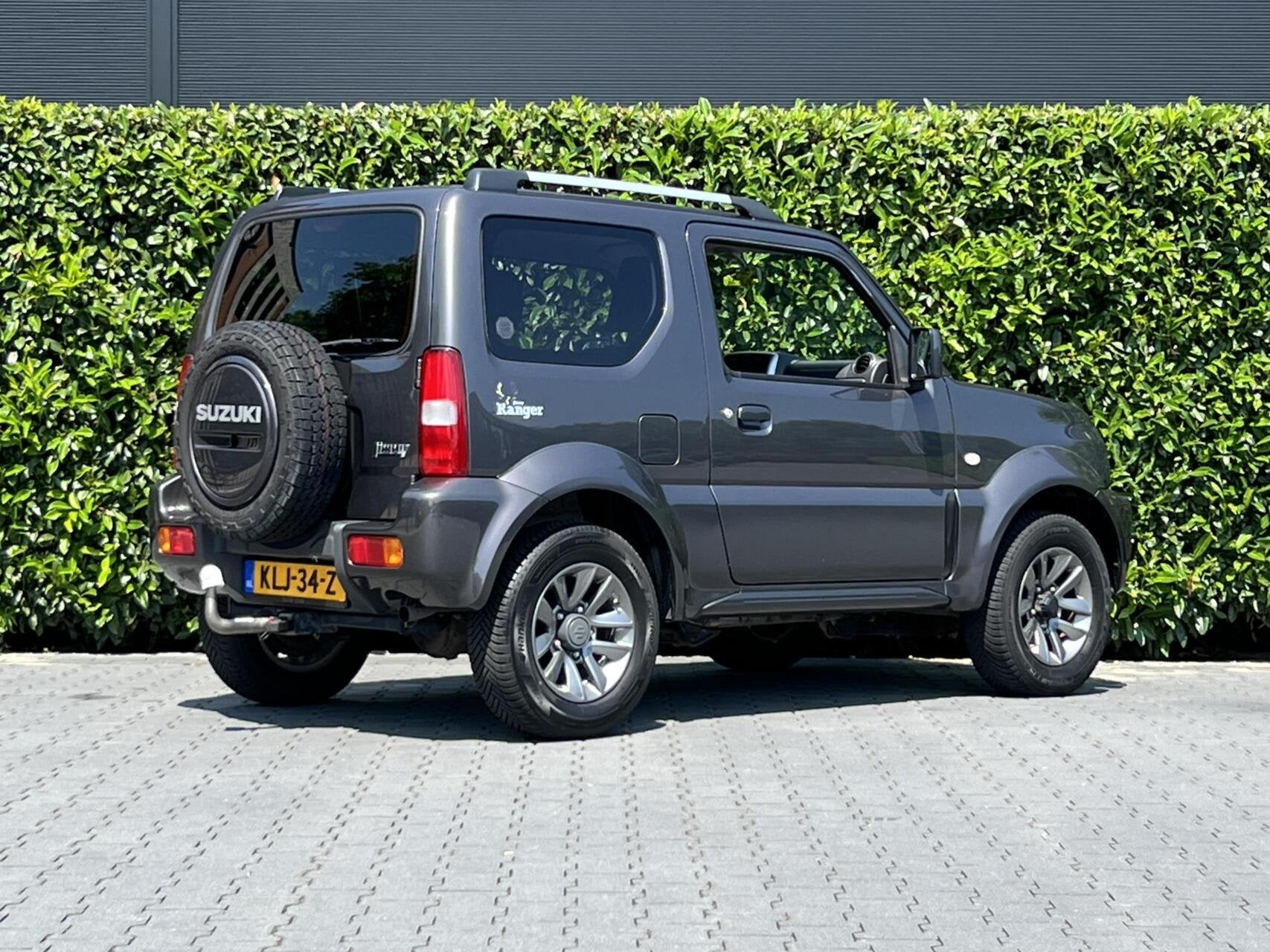 Suzuki Jimny 1.3 Exclusive RANGER, LEDER, AIRCO, STOELVERWAR, 86 pk, Gebruikt, Zwart, 4 stoelen