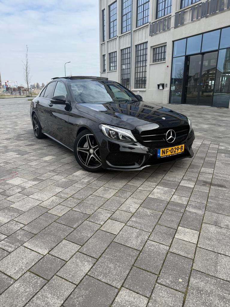 Mercedes-Benz C-Klasse C180 AMG Aut7 2017 NAP, Automaat, 1800 kg, Zwart, Particulier