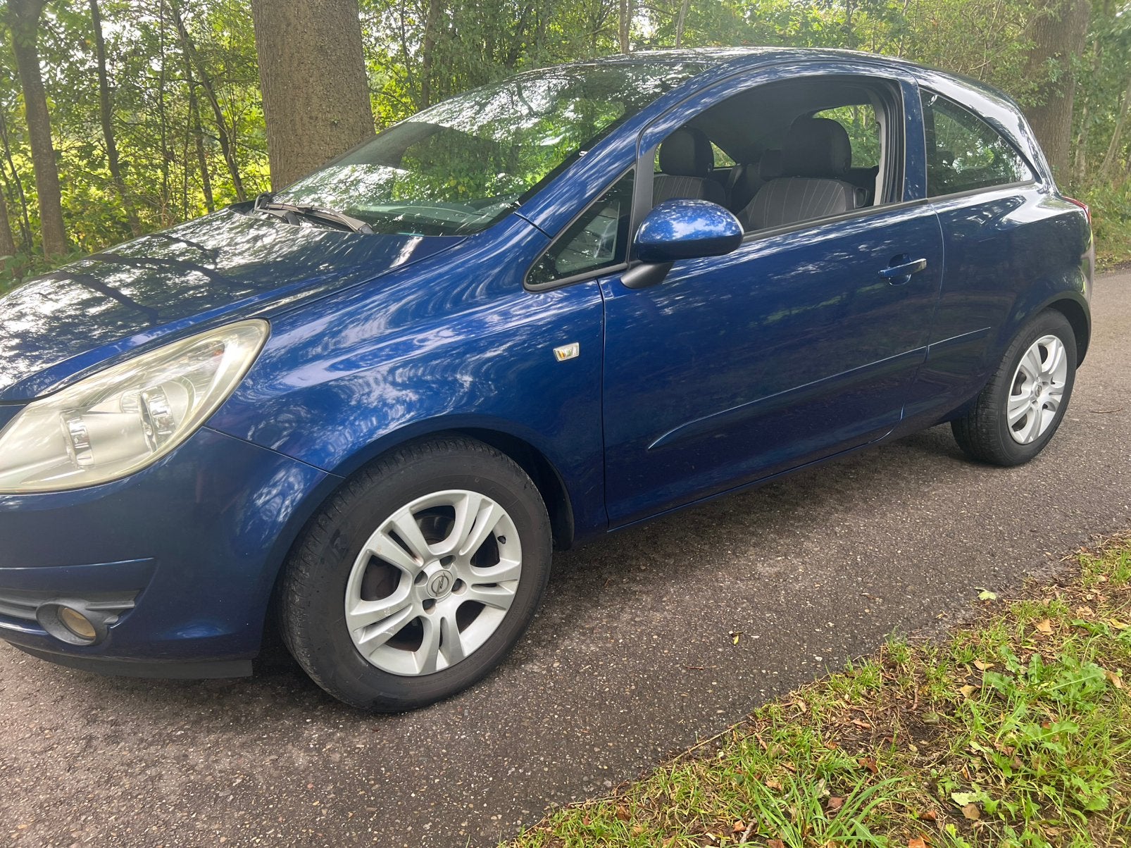 Opel Corsa 1.2 16V 3D WR 2007 Blauw, Voorwielaandrijving, 40 €/maand, Zwart, 4 cilinders