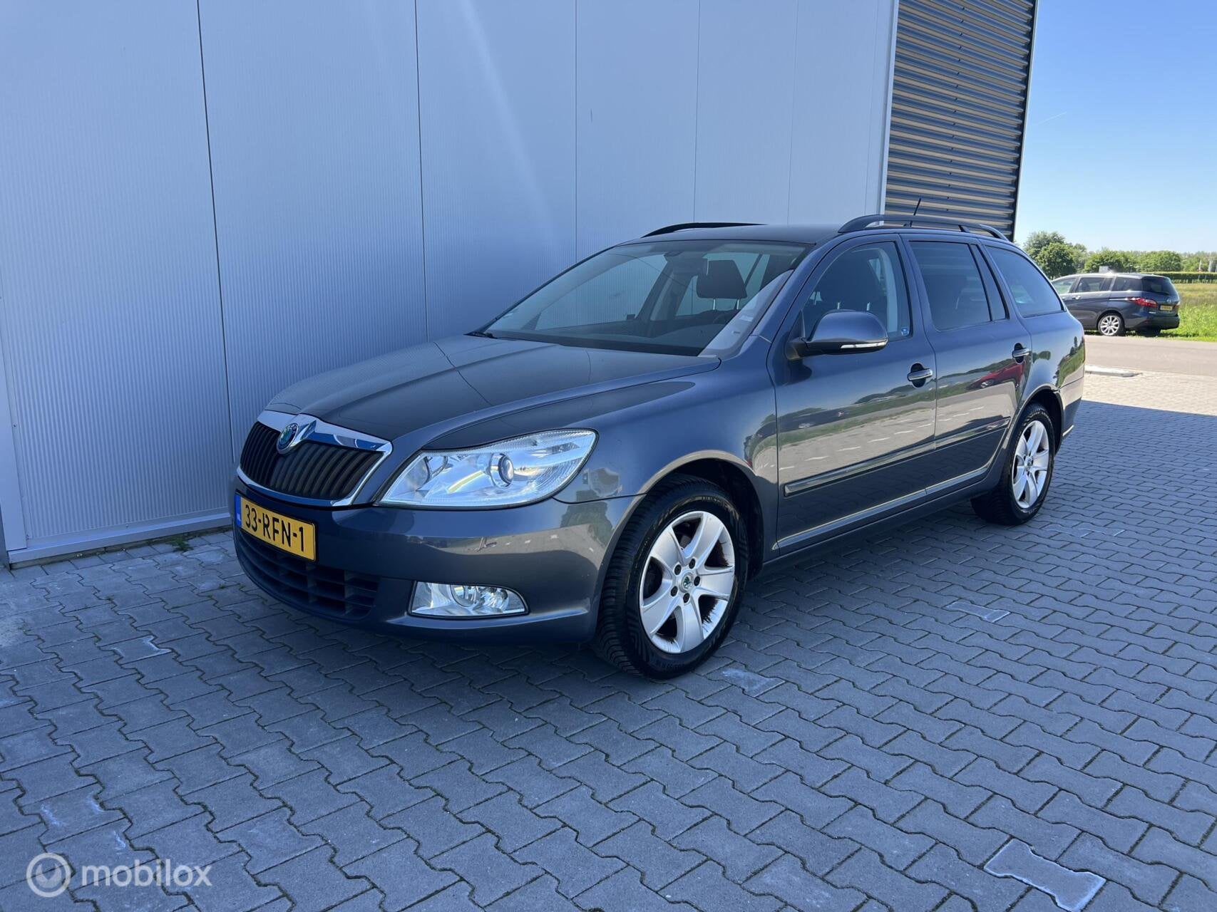 Skoda Octavia Combi 1.2 TSI Ambition Business Line, Auto's, Euro 5, Gebruikt, 4 cilinders, Origineel Nederlands
