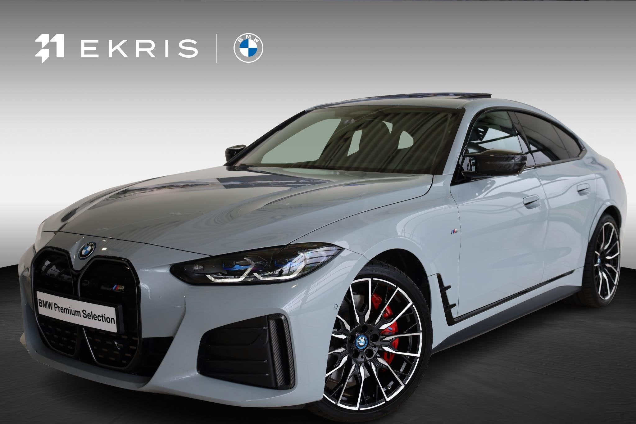 BMW i4 M50 High Executive | M Sportpakket Pro | Glazen schui, Stof, 520 km, Met garantie (alle), 2190 kg