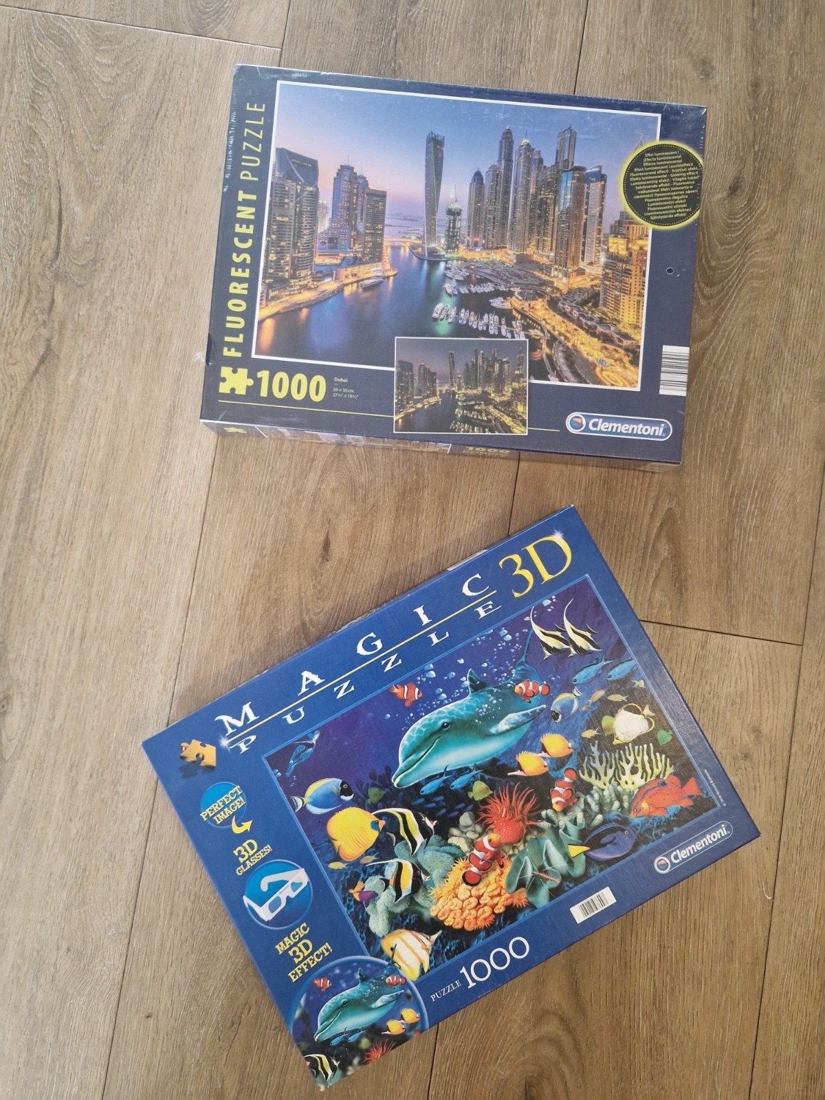 2 Clementoni Puzzels: Dubai Fluorescerend & Magic 3D Zee, Ophalen of Verzenden, 500 t/m 1500 stukjes, Nieuw, Legpuzzel