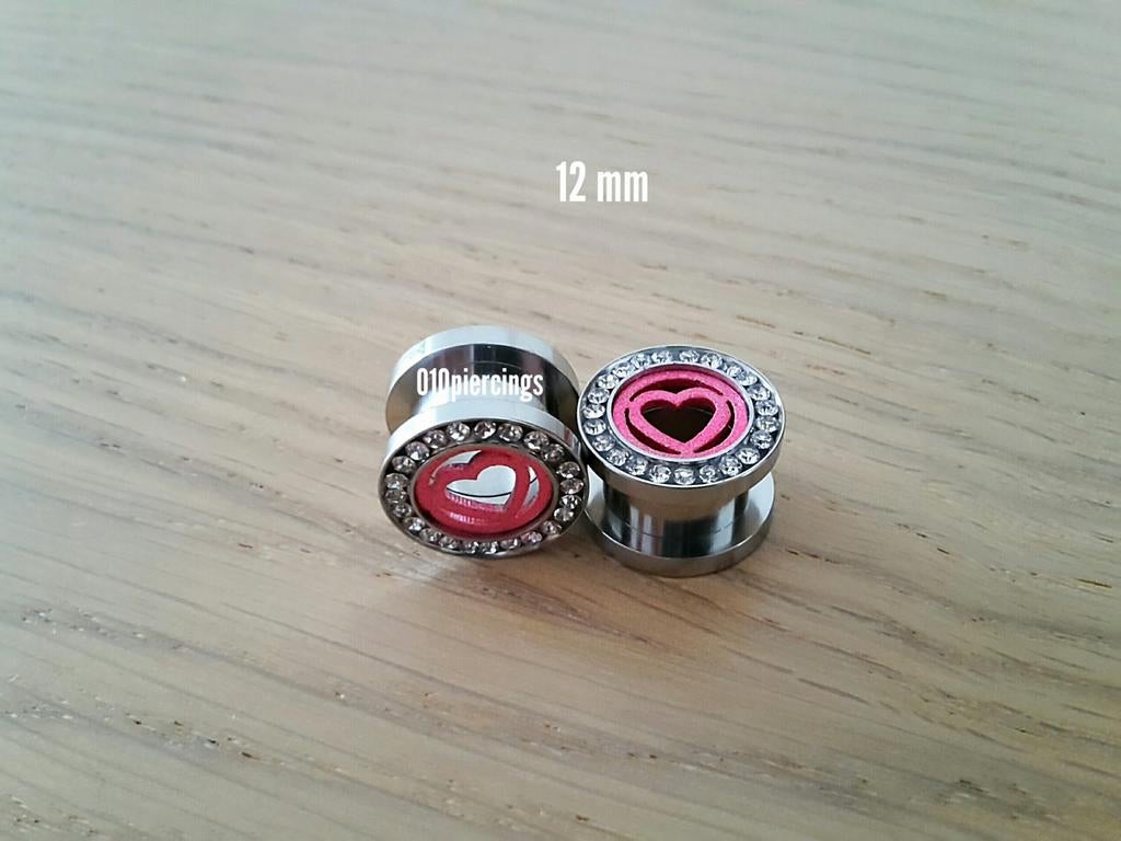 Nieuwe tunnels. Staal. Roze hartjes. Steentjes. 16 mm., Ophalen of Verzenden, Zo goed als nieuw, Staal, Oor- of Traguspiercing