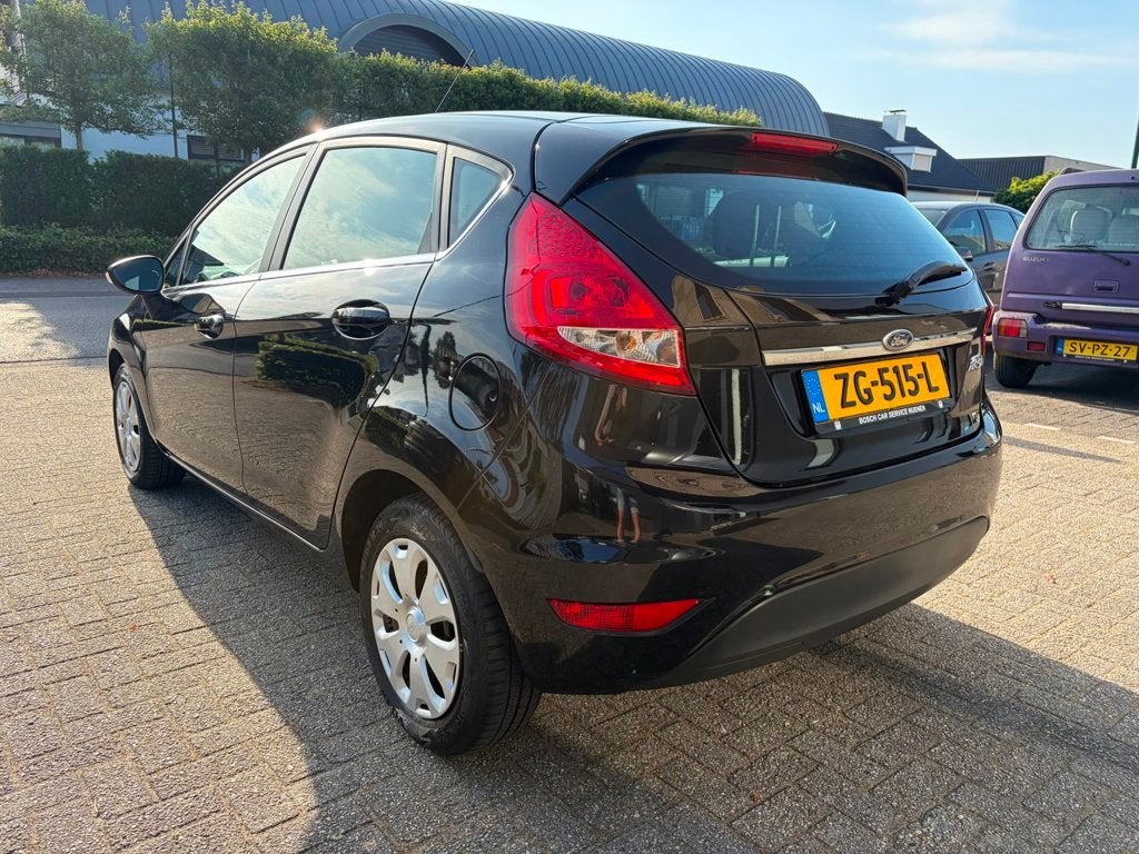 Ford Fiesta 1.4 Ghia, Stoelverw. Clima, Bluetooth, Auto's, Voorwielaandrijving, Euro 5, Zwart, Bedrijf