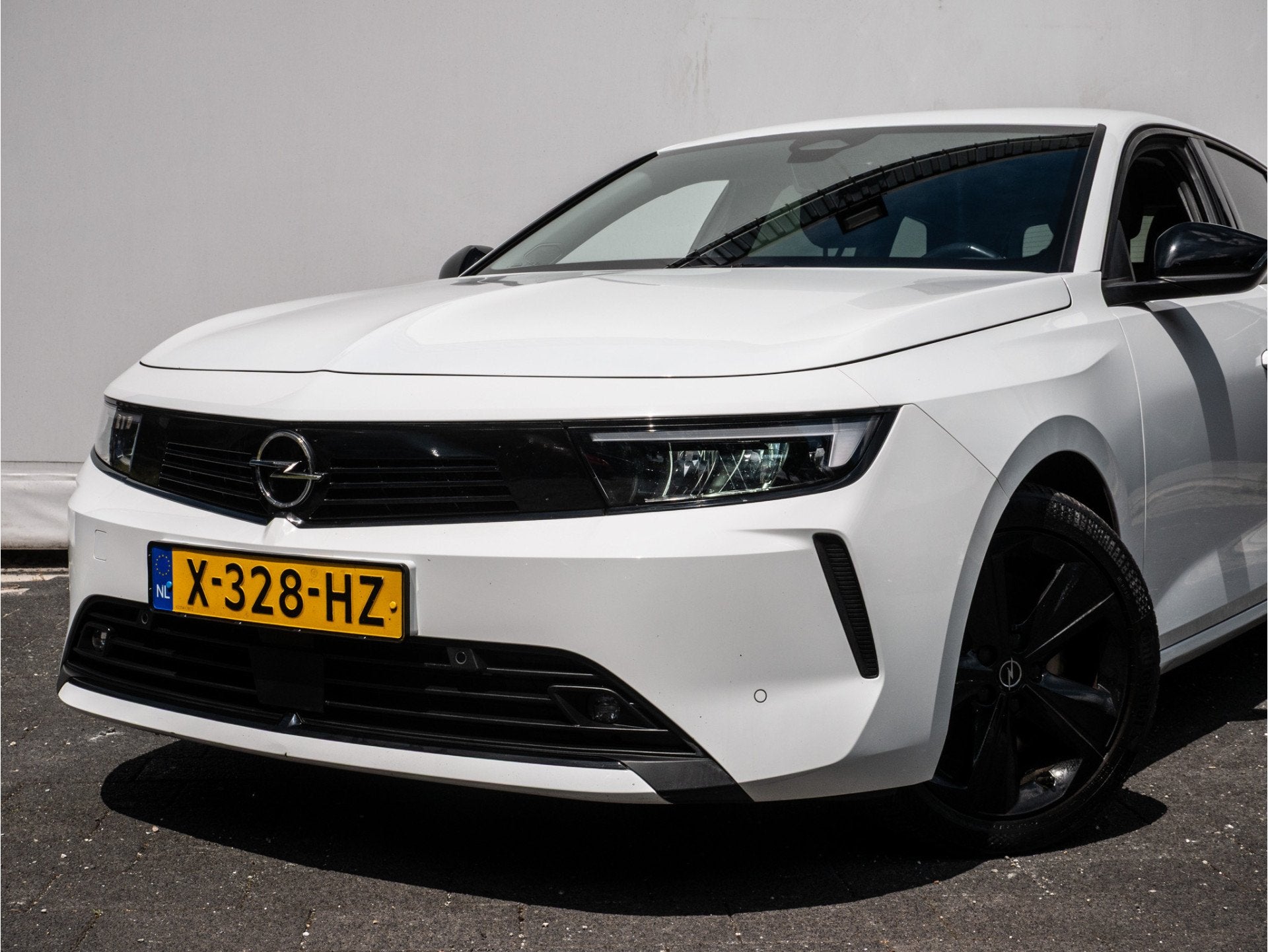 Opel Astra Sports Tourer 1.6 Plug-in Hybrid Business Edition, Auto's, Opel, Stof, Gebruikt, 4 cilinders, Wit