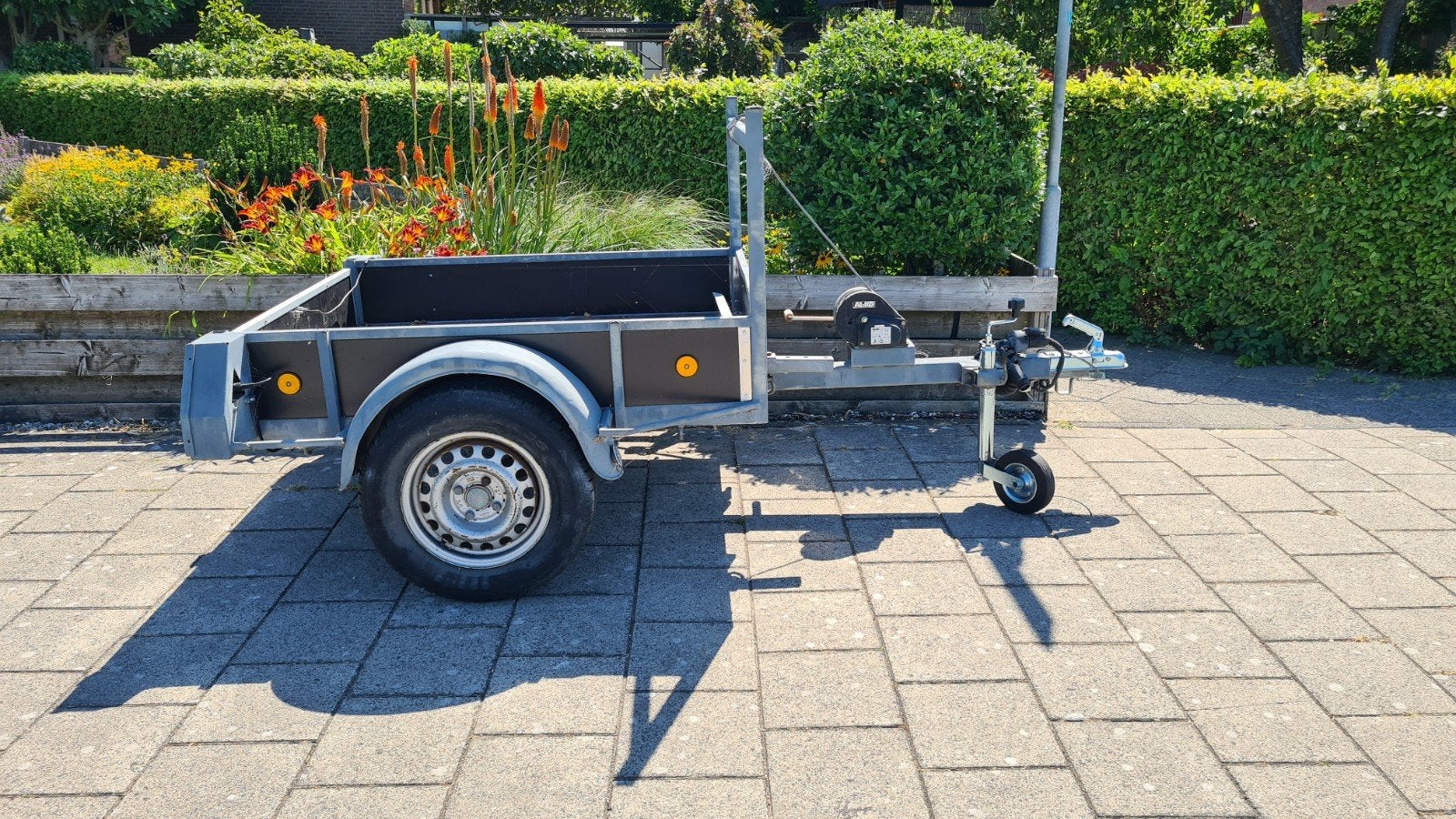 Trilplaat aanhangwagen., Ophalen