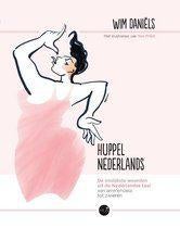 Wim Daniels - Huppelnederlands, Boeken, Romans, Zo goed als nieuw, Ophalen of Verzenden