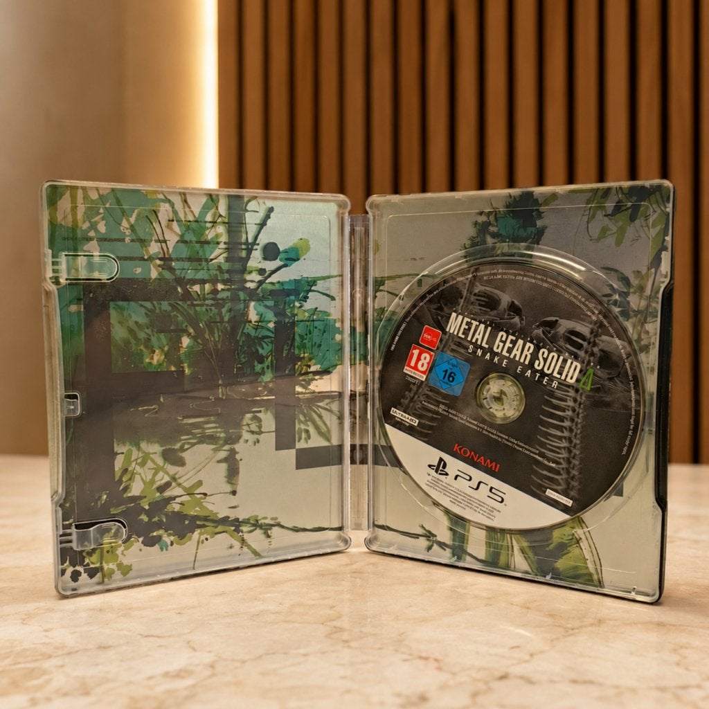 Metal Gear Solid Delta: Snake Eater - Deluxe Edition, Sony, Zo goed als nieuw, Support@sony.com, 1-7-1 Konan, Minato-ku
Tokyo 108-0075
Japan