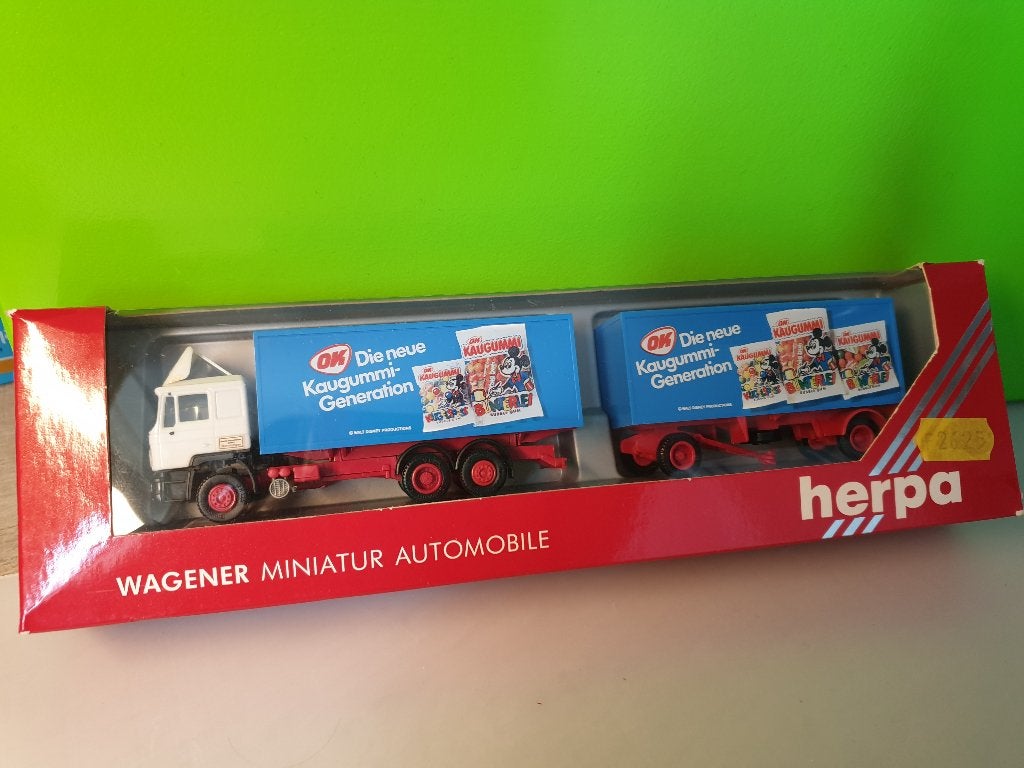 Herpa - MAN F90 OK Kaugummi [wit] 1/87 MIB, Ophalen of Verzenden, Zo goed als nieuw, Bus of Vrachtwagen, Herpa