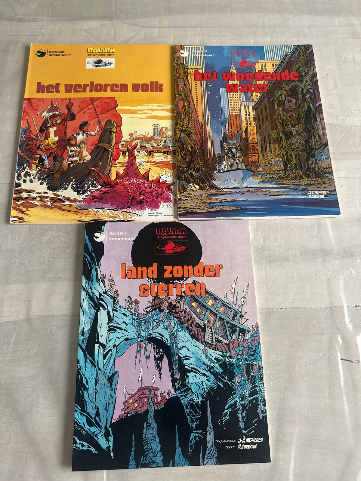 Ravian. 3 stuks : Het Verloren Volk, Het Woedende Wat, Meerdere stripboeken, Ophalen of Verzenden, Gelezen