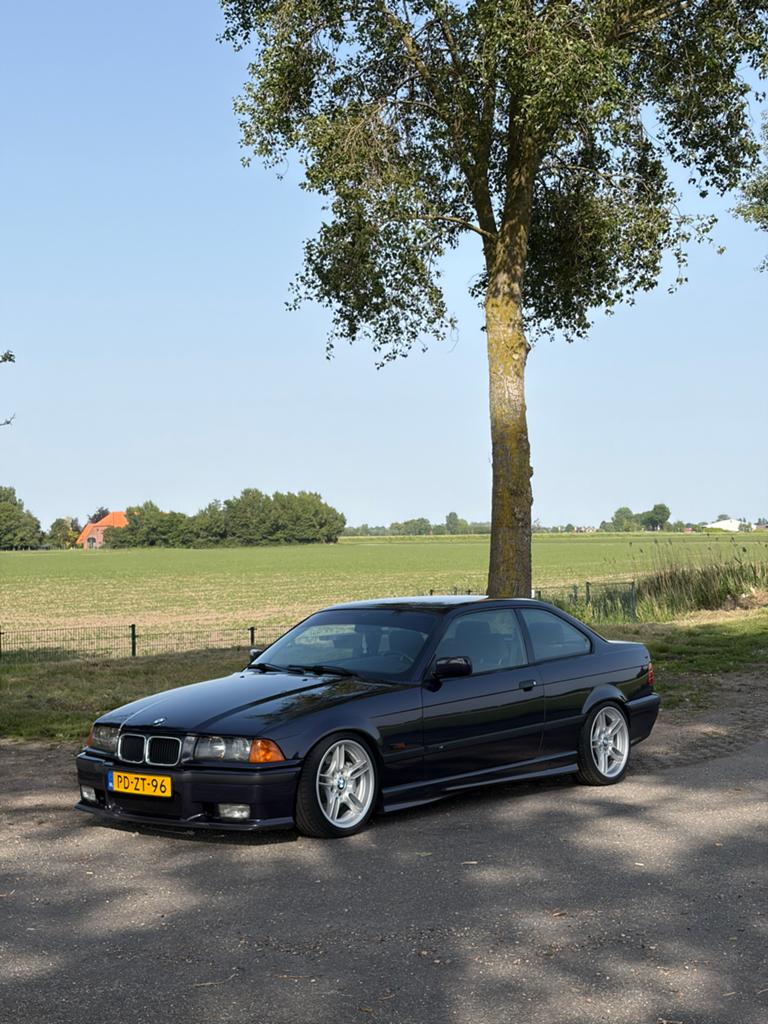 BMW e36 3 serie 323i Coupe handbak 1996 Airco Maderia Violet, Achterwielaandrijving, Zwart, Origineel Nederlands, Handgeschakeld