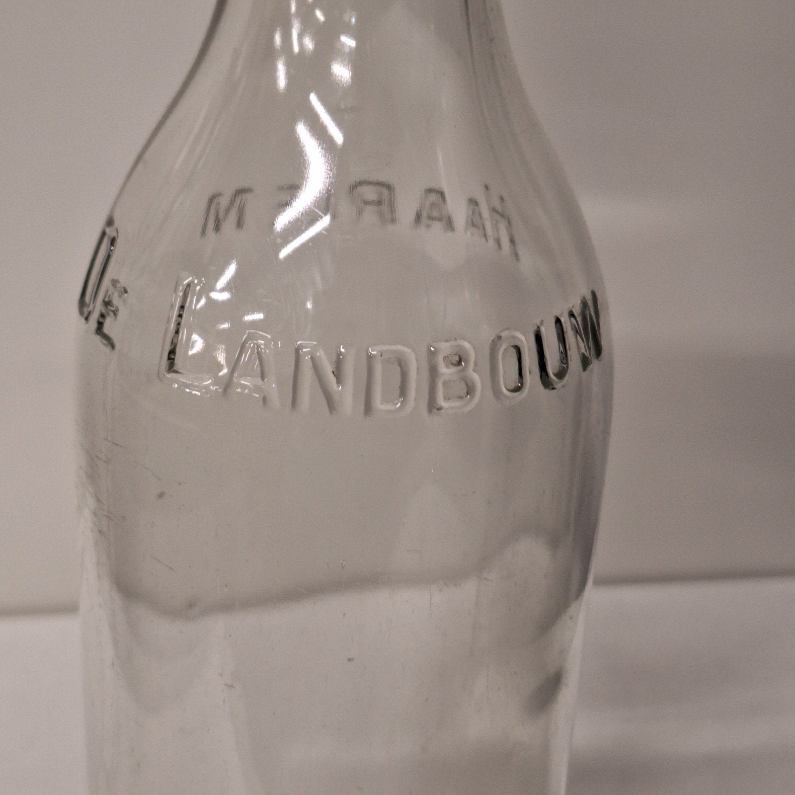 Vintage 1 liter melkfles 'De Landbouw HAARLEM' met beugeldop, Verzenden